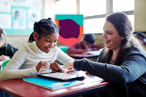 Teacher assisting student in classroom