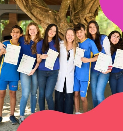 A group of Brazilian students holding their Cambridge certificates