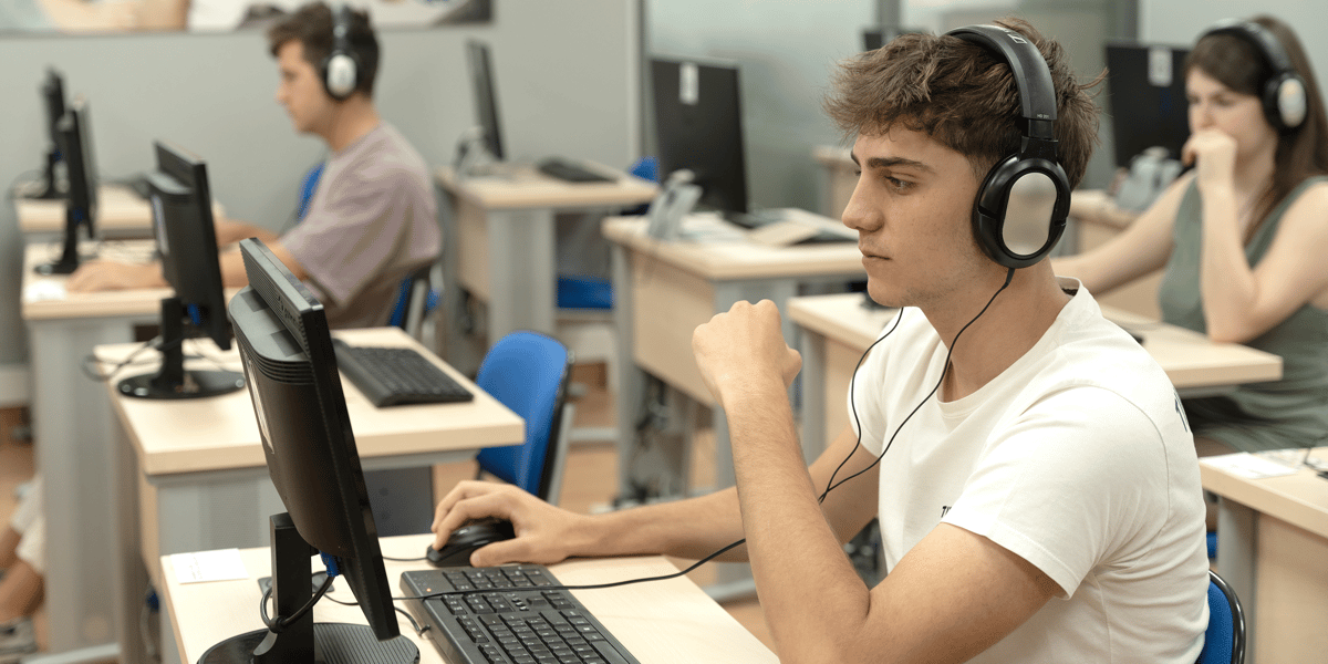 Male student doing CEQs Digital examination