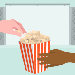 Popcorn and two hands, at the cinema