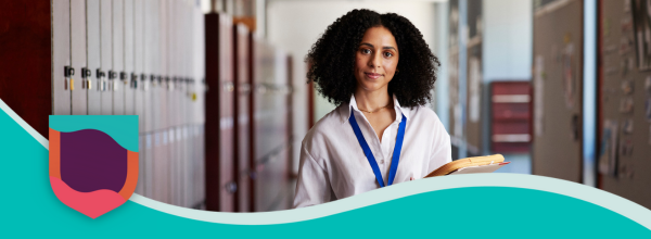 Teacher smiling in a corridor