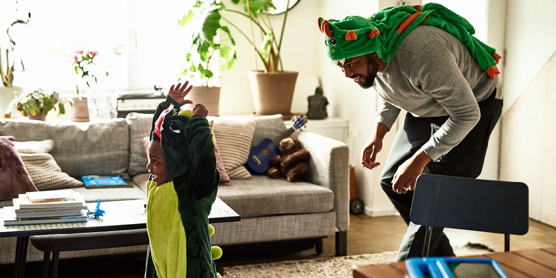 Parent chasing their child in the frontroom 