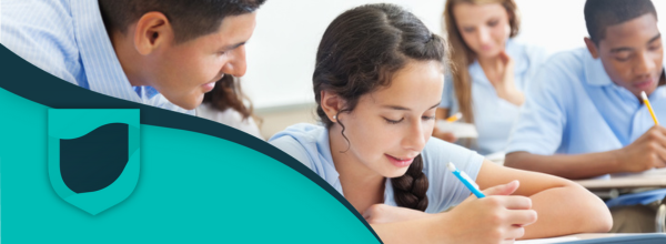 Teenage students writing in a notebook